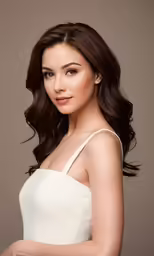 an attractive woman wearing white posing for a picture