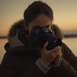 the woman is taking pictures with her camera