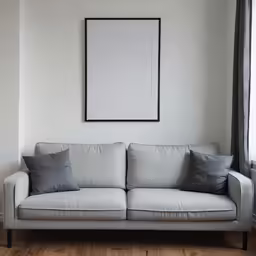 a sofa with several pillows in a living room