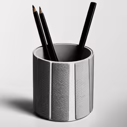 some pens and pencils inside a cup
