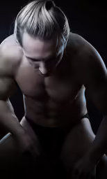 a man in underwear is posing with his back turned