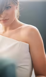 a beautiful young woman in a white dress
