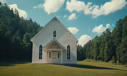 a church sits in the middle of a green field