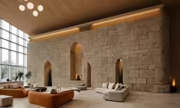 large white and orange couches sit on large cement floors