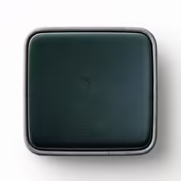 an empty square black metal container with silver trim