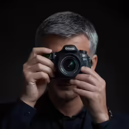 a man taking a photo with a camera