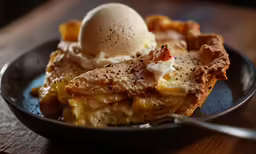 food is prepared in a bowl with a scoop of ice cream