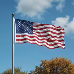 an american flag flying high in the sky