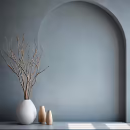 two vases are on a white and grey counter