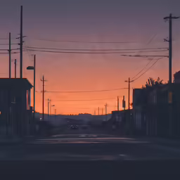 a red light is over a street with some buildings and telephone poles