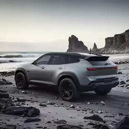 a silver jeep parked on a rocky beach