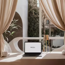 a laptop computer that is on a table