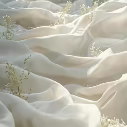 a blanketed background with a bunch of flowers in it