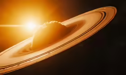 saturn with its rings in the dark sky