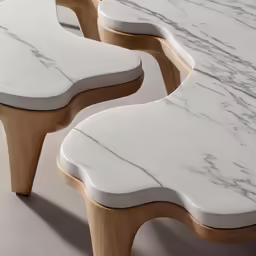 an elaborately designed marble table sitting on a cement floor