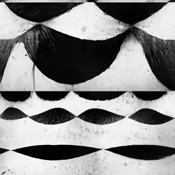 a pattern made up of black wavy shapes