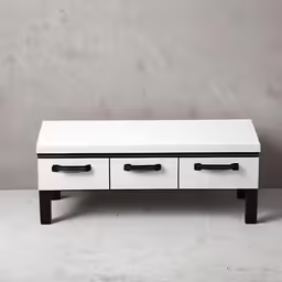 a white table with three drawers on top