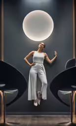 woman standing beside two chairs looking up