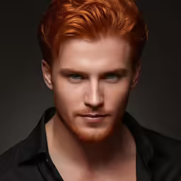 a red headed man with his hair pulled back