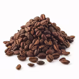 roasted coffee beans spilled out onto white background