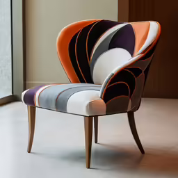 the colorful upholstered arm chair is in front of a large window