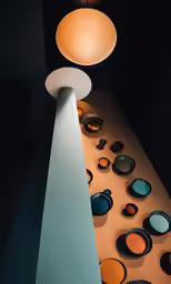 an artistic display with several colorful plates sitting on it