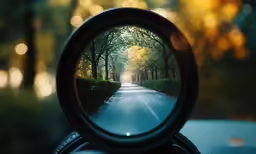 the view of a rain covered road through a magnifying glass