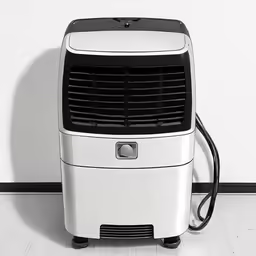 a small white air conditioner is sitting on the floor
