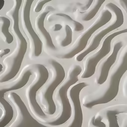 there are ripples made of white wax and a gray paint