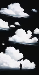 a man standing in front of many clouds