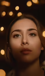 a woman with brown eyes looking at the camera