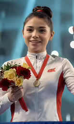 a young woman holding onto a flower bouquet