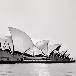 a black and white photo of the opera sydney