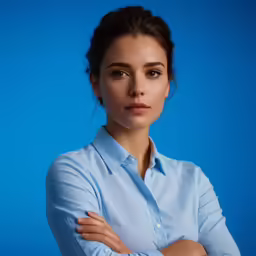 a close up of a person wearing a shirt and tie