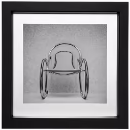 a chair that is sitting up against a wall