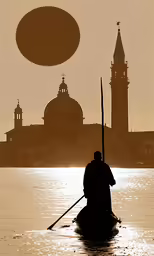 a man with a boat sits in the water next to a city
