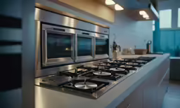 a gas range in a modern kitchen with appliances