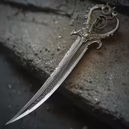 this is a silver and black dagger with intricate designs on it