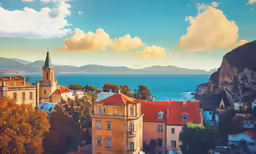 this is the view from the top of this building overlooking the water and mountains