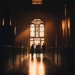 a couple of people that are walking down the hallway