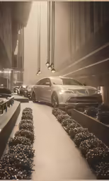 several cars driving down the road in front of a tall building