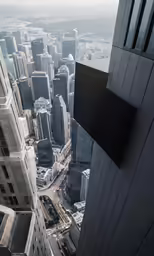 a tall building towering above the city