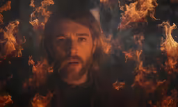 an image of jesus in flames on the screen