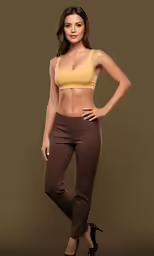 a woman wearing high heels and an orange top is posing for a picture
