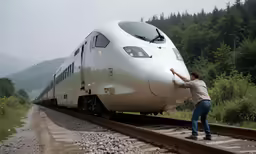 the man is pulling his train out of the tracks