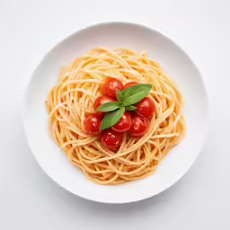 a white bowl filled with pasta topped with cherry tomatoes