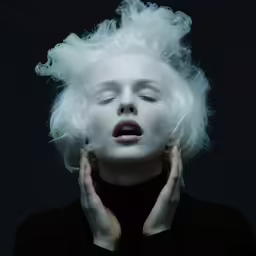 woman with white hair in artistic portrait for photo