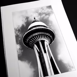 an open photograph frame shows the top of a tower