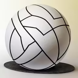 a white ball sitting on top of a black stand