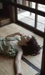 a woman laying down on the floor in a room